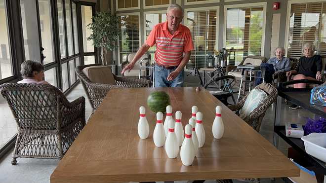 Resident bowling with watermelon at Liberty Place