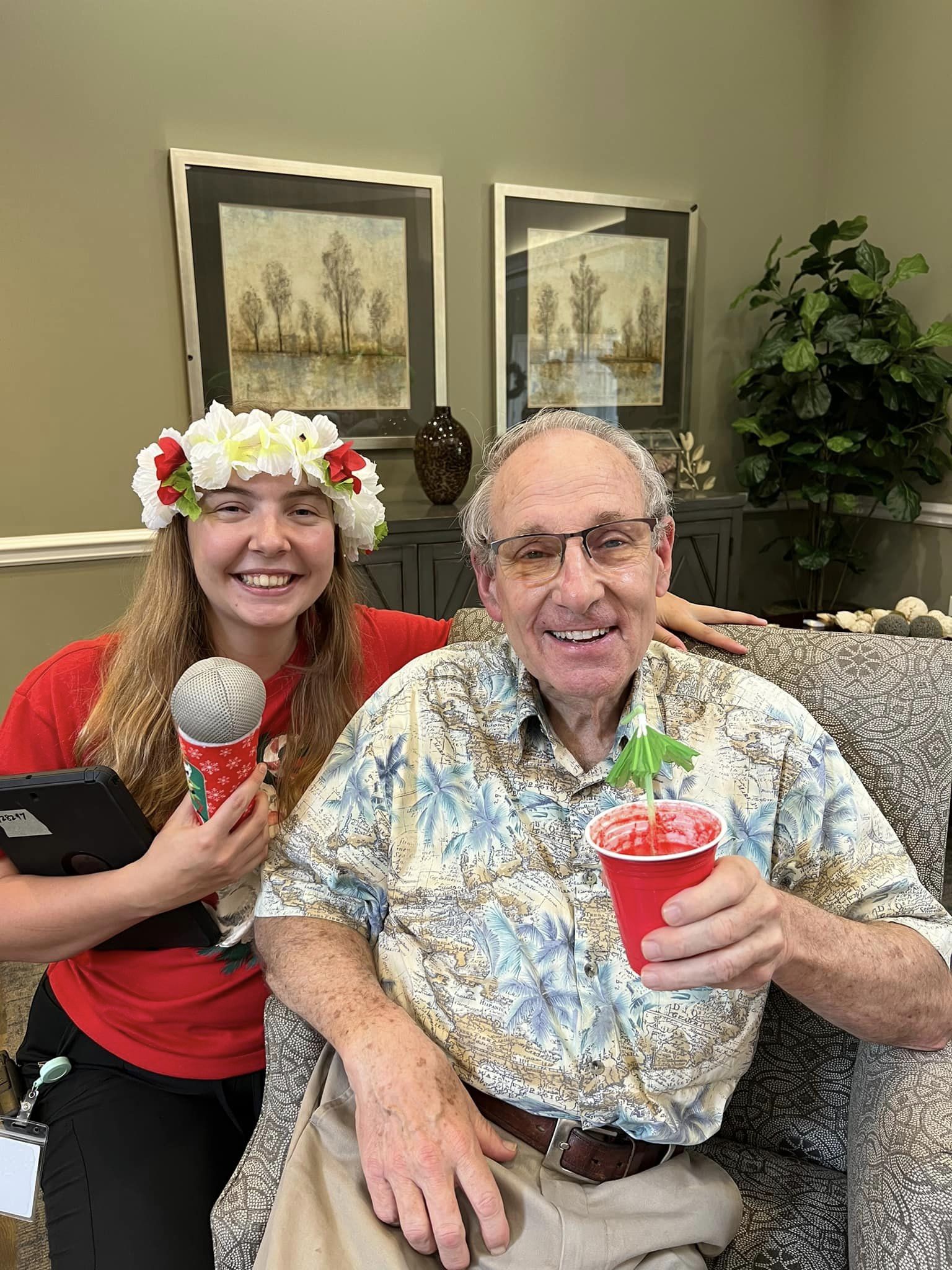 resident and staff member at the luau