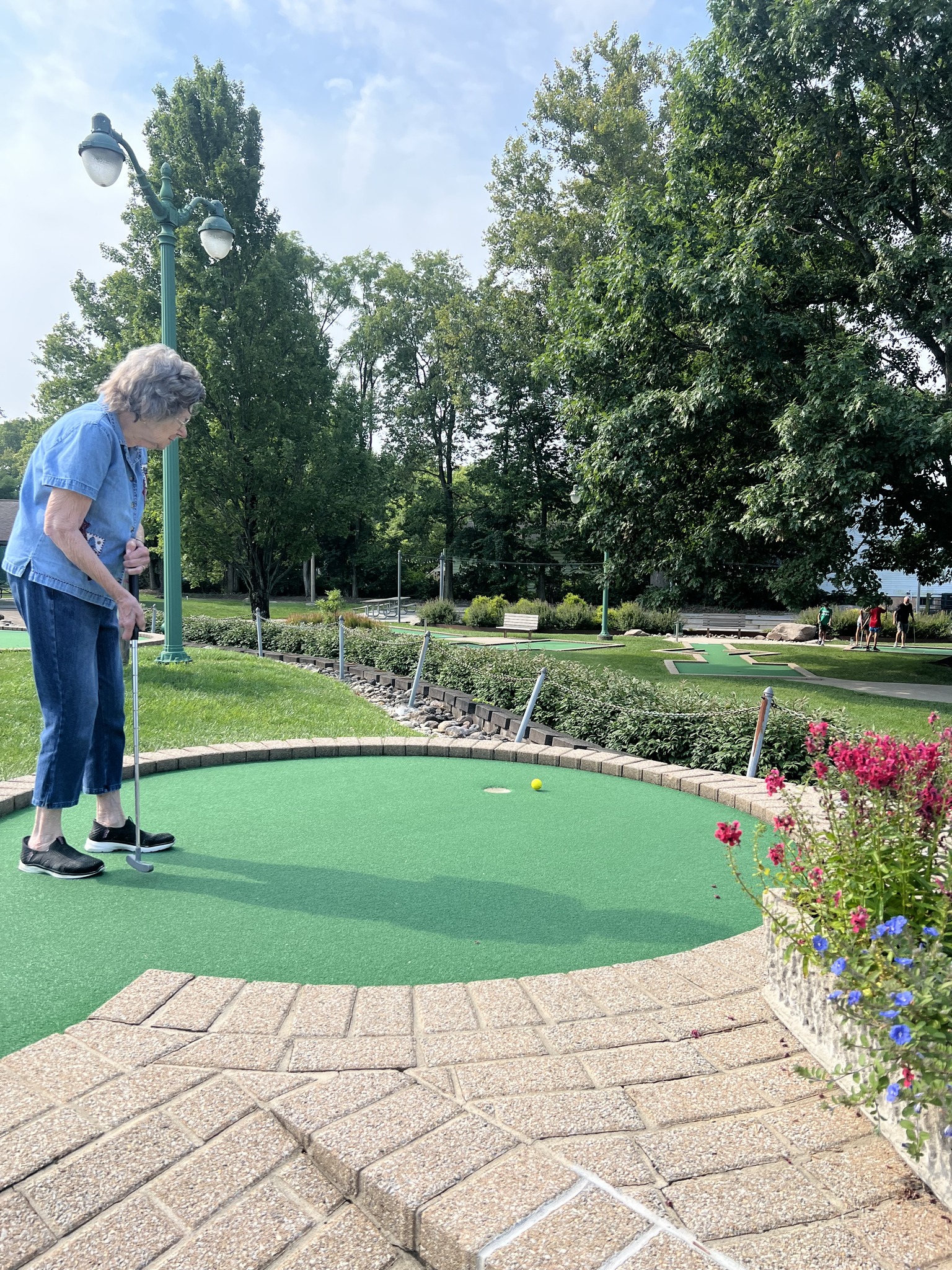 Liberty Place resident putt putt golfing