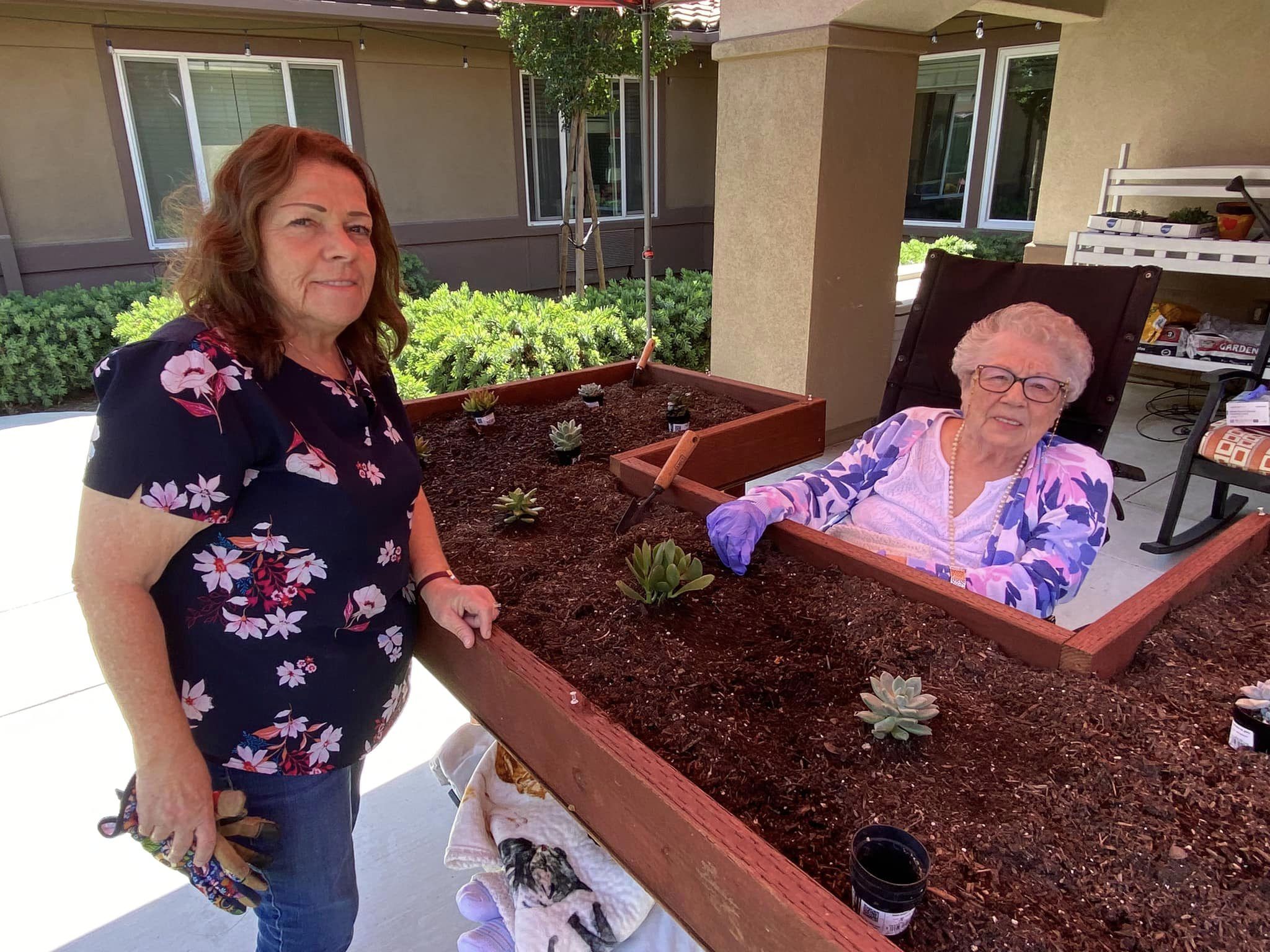 Resident and daughter gardening