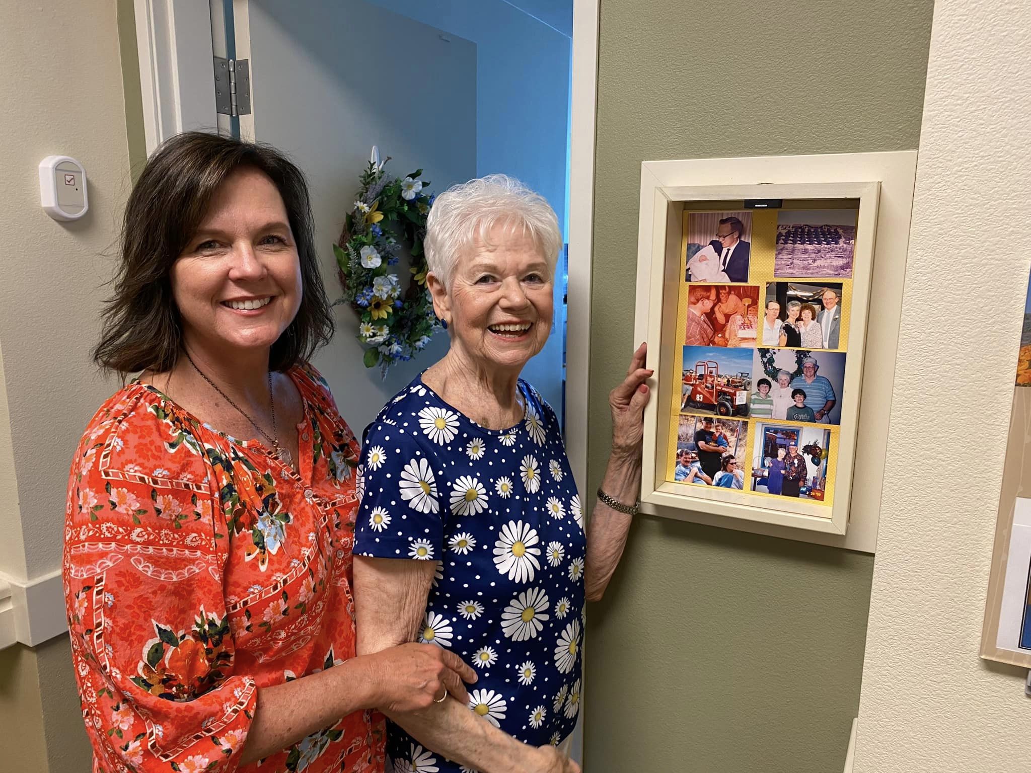 Vineyard Place resident and daughter displaying shadow box